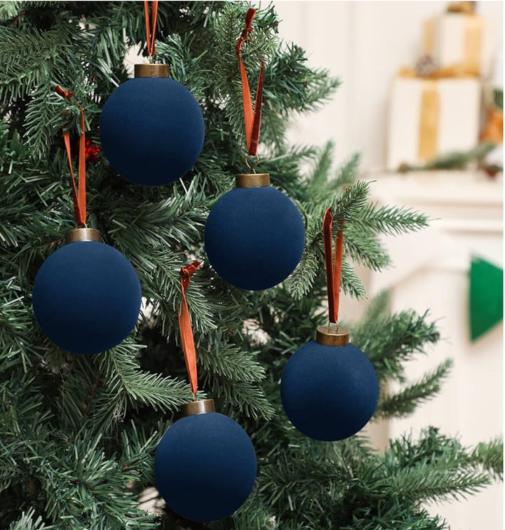 Five navy velvet ball ornaments.
