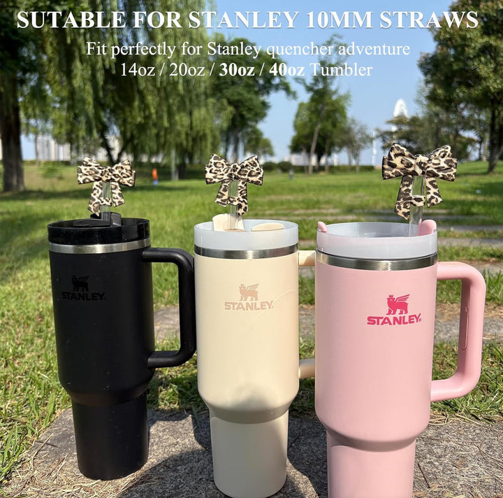 Three large bow silicone straw covers, available for 10mm straws in various sizes, keep drinks dust-free.