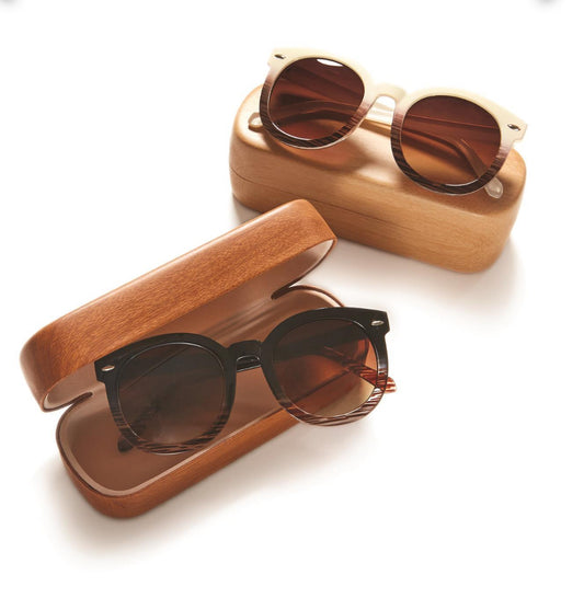 Two pairs of Metal Frame Sunglasses with Hard Case. One pair has light-colored frames with dark lenses; the other has dark-colored frames with dark lenses. Cases are light brown with curved corners. Available sizes: N/A.