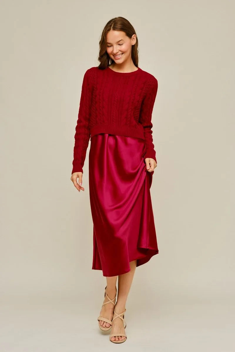 Deep red cable knit sweater and matching satin midi dress. Available in sizes S, M, L.