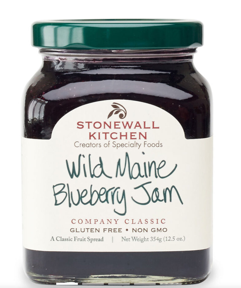Stonewall Kitchen Wild Maine Blueberry Jam. Gluten-free, non-GMO. 354g (12.5oz) jar with green lid and label showcasing Maine blueberries. "Company Classic" on bottom of label.