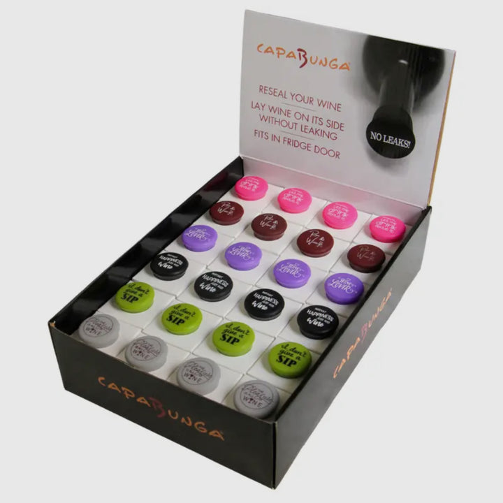 Colorful Wine Cap resealable caps with witty sayings; leakproof, fridge-door friendly; available in standard and large sizes.