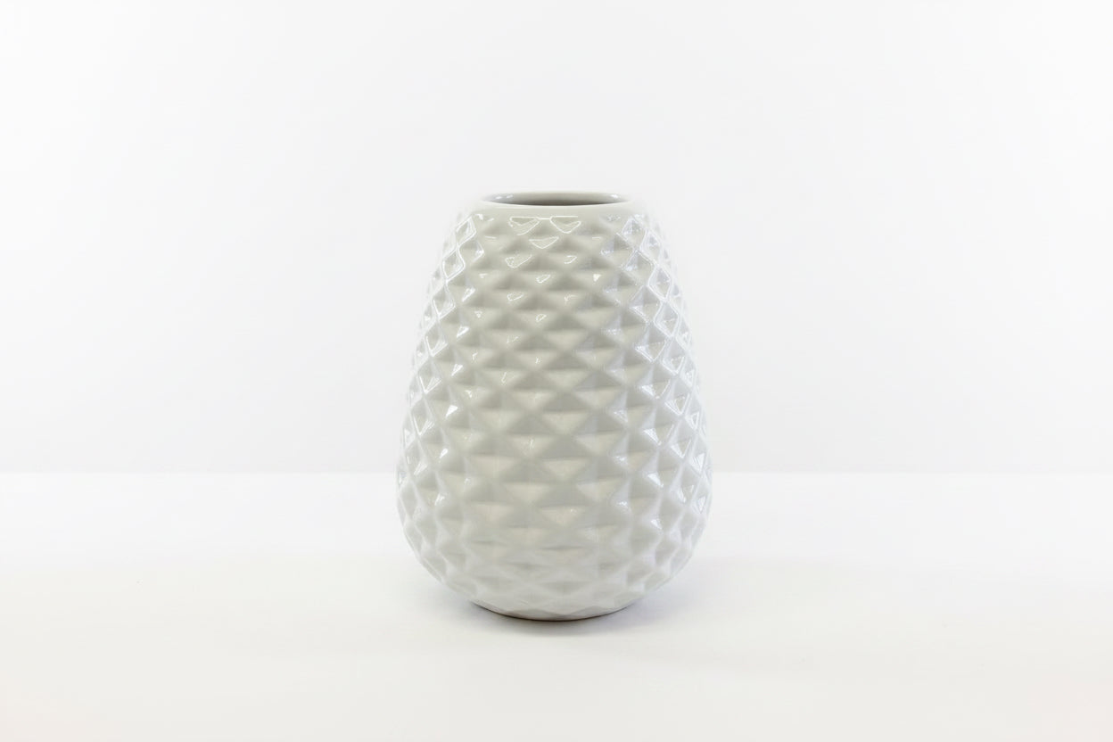 White ceramic vase with textured geometric diamond pattern; available in multiple sizes.