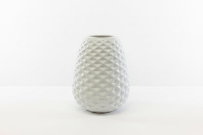 White ceramic vase with textured geometric diamond pattern; available in multiple sizes.