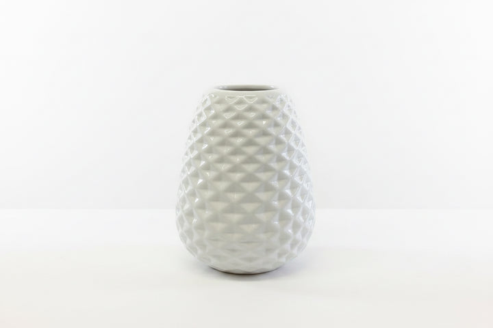 White ceramic vase with textured geometric diamond pattern; available in multiple sizes.