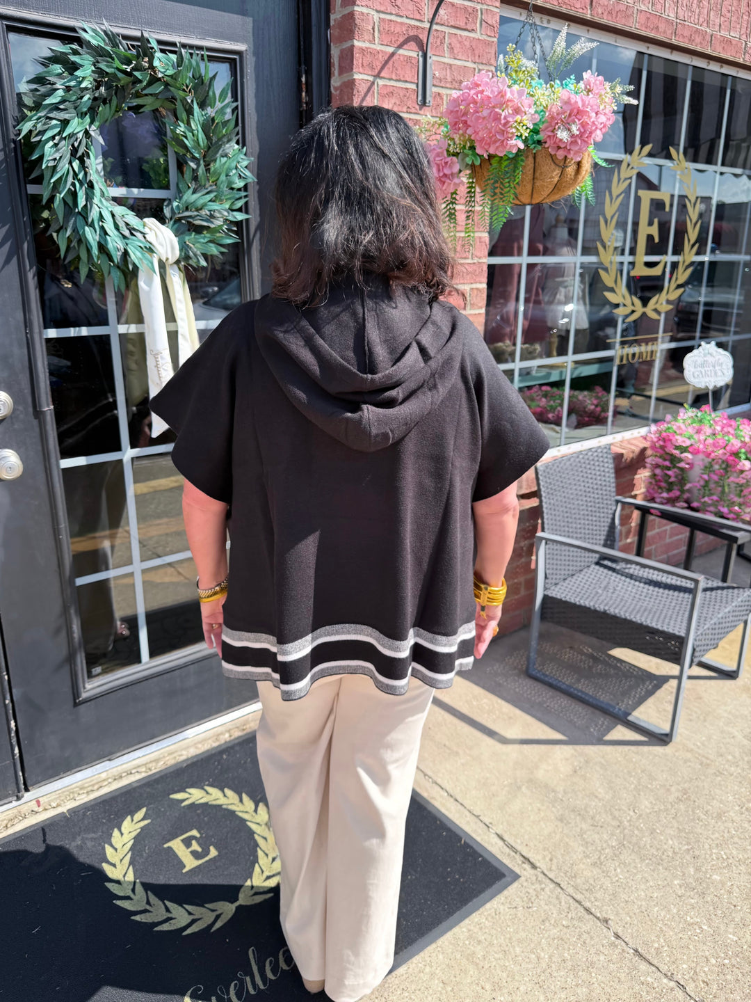 Aspen Stripe Hoodie Poncho shown; features striped pattern and hood. Available in sizes XS–XL.