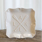 Cream ceramic platter with scalloped edges, crossed oars, letters "A L K E", 11.5" size.