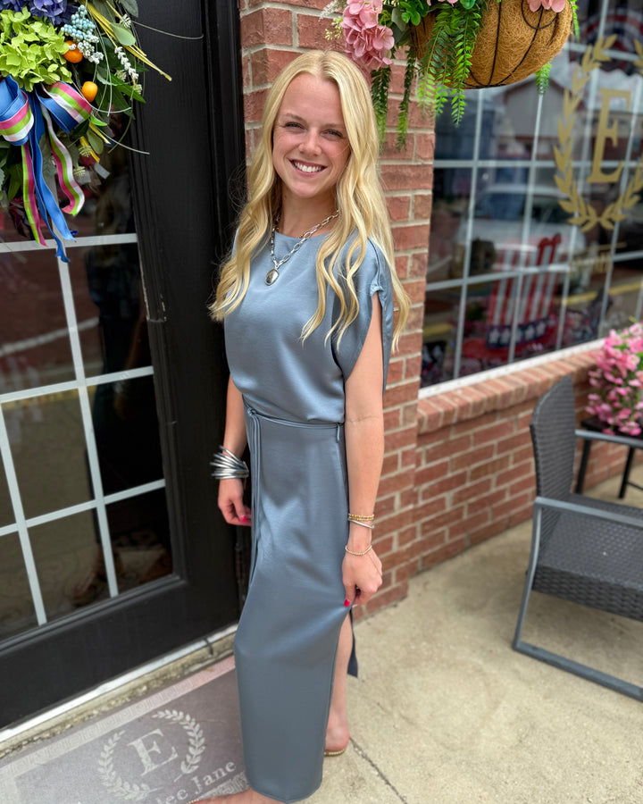 Slate Blue Satin Tie-Waist Midi Dress with a fitted waist and midi length. Available in sizes XS–XL.