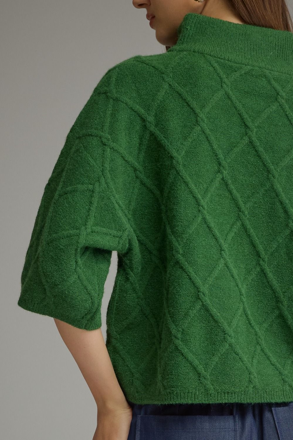 Green Diamond textured stand collar sweater with elbow-length sleeves. Available in all sizes.