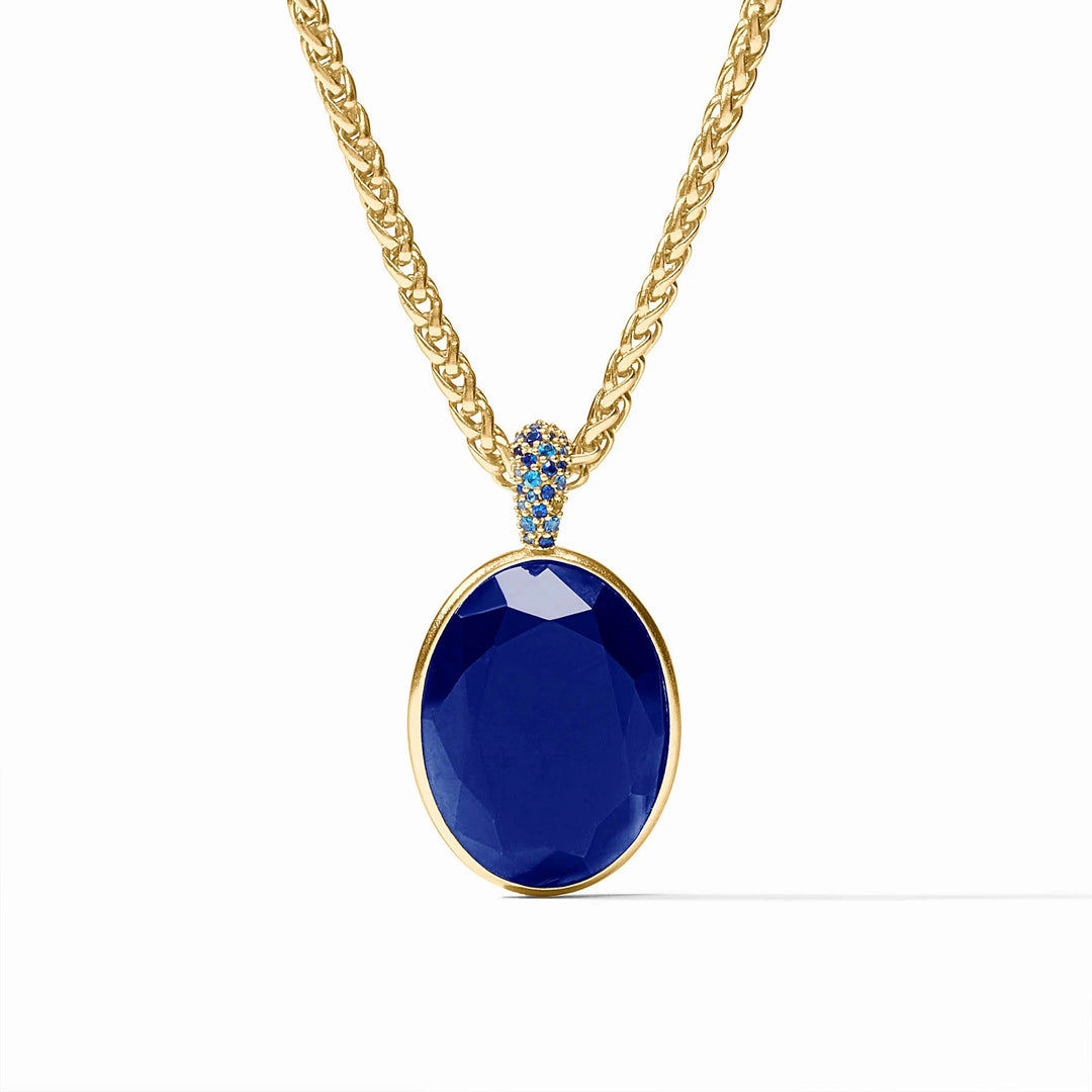 Stardust Statement Necklace, 24K gold-plated chain with a large oval blue CZ pendant and blue stones at the bail.