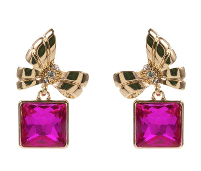 Pink Bow Dangle Earrings with bow-shaped tops, clear crystal centers, and dangling bright pink square-cut gemstones. Available in small and medium sizes.
