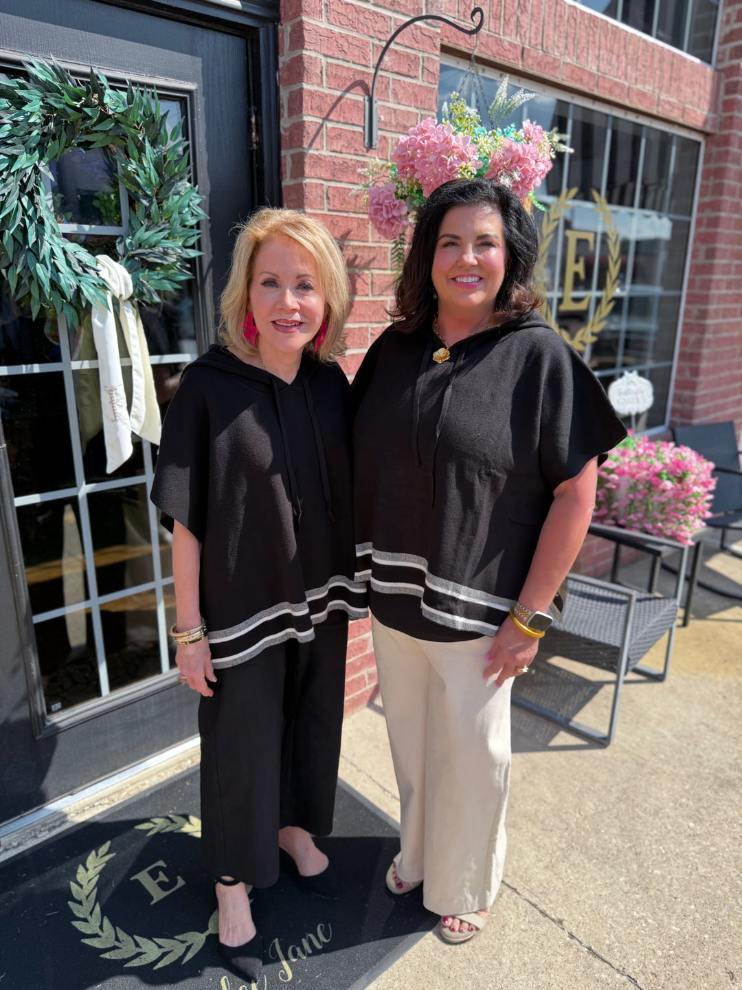 Aspen Stripe Hoodie Poncho, black with white stripes, available in sizes XS–XL.