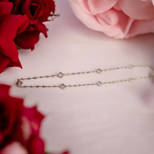 The Eliza Aqua Necklace: delicate gold with small diamond-shaped accents. Available in 16", 18", and 20" sizes.