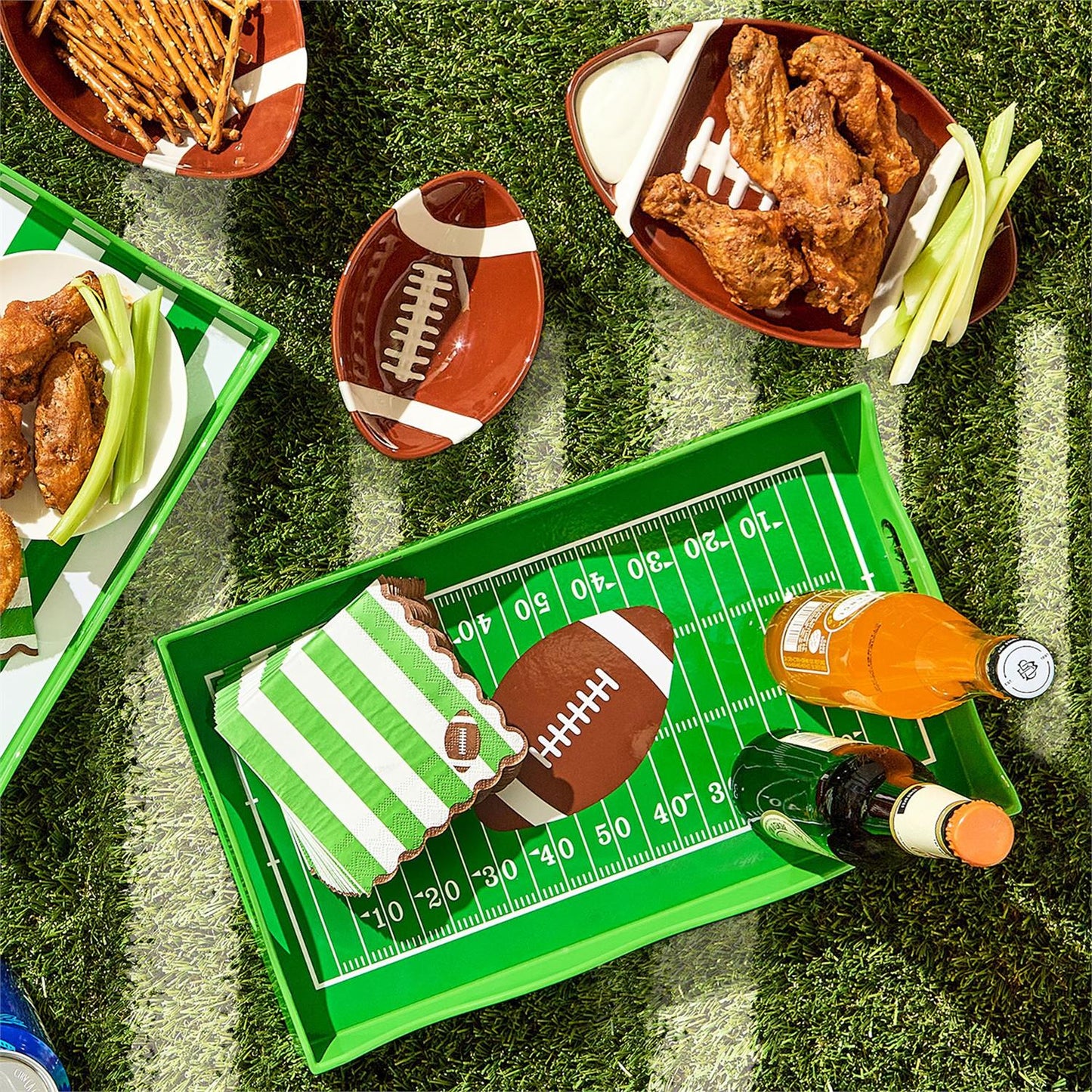 Football Tidbit Bowls, shaped like footballs, available in small (6″ long) and medium (9″ long) sizes.