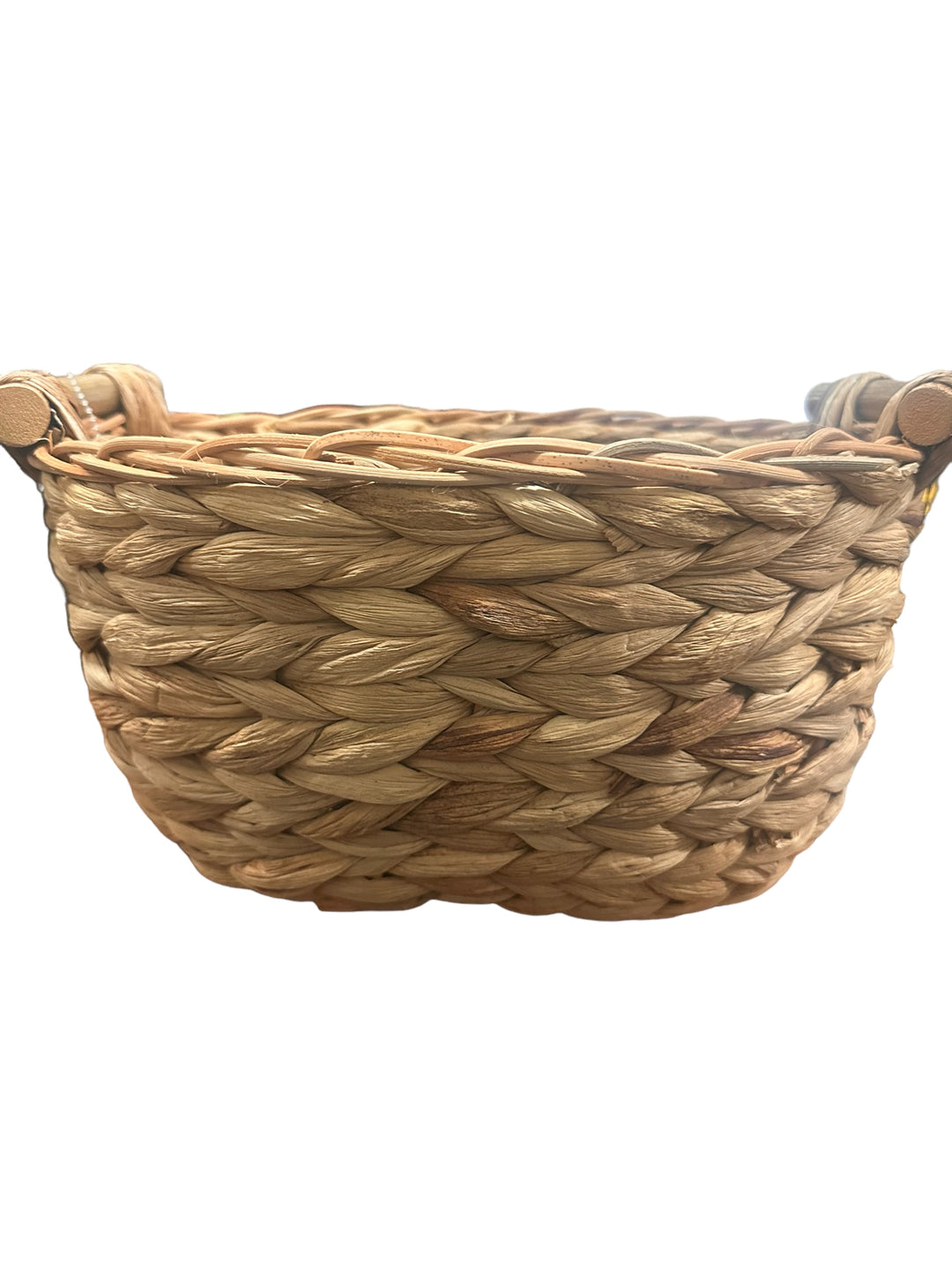 Round, woven straw or wicker basket with two small side handles. Available in small, medium, and large sizes.