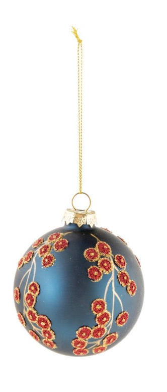Matte navy blue botanical glass ornament with raised glittery red berry clusters on gold stems, on a gold string.