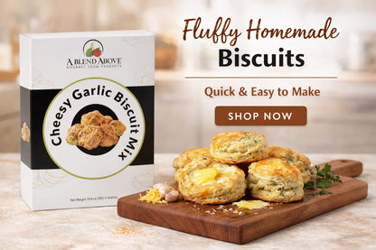 Cheesy Garlic Biscuit Mix package. Available in 10 oz and 20 oz sizes. Text: "Fluffy Homemade Biscuits. Quick & Easy to Make with Cheesy Garlic Biscuit Mix. Shop Now.