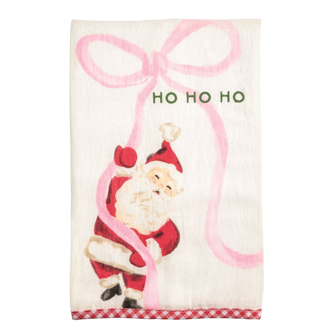 White Christmas hand towel with Santa Claus, pink ribbon, “HO HO HO” text, and red and white checkered hem.