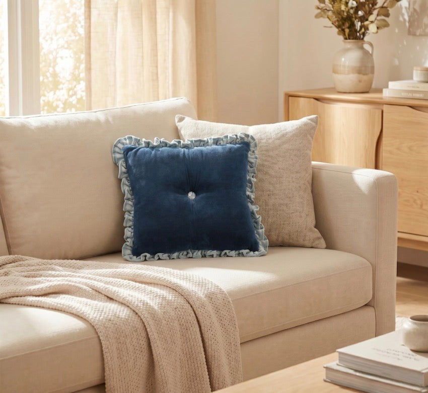 Blue Velvet Ruffle Lumbar Pillow with ruffled edges, available in 12″x20″ and 14″x26″ sizes.