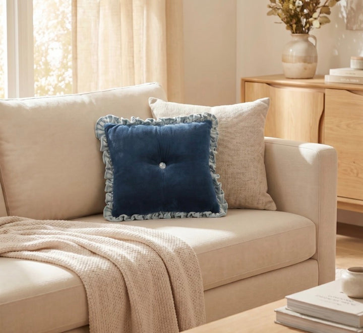 Blue Velvet Ruffle Lumbar Pillow with ruffled edges, available in 12″x20″ and 14″x26″ sizes.