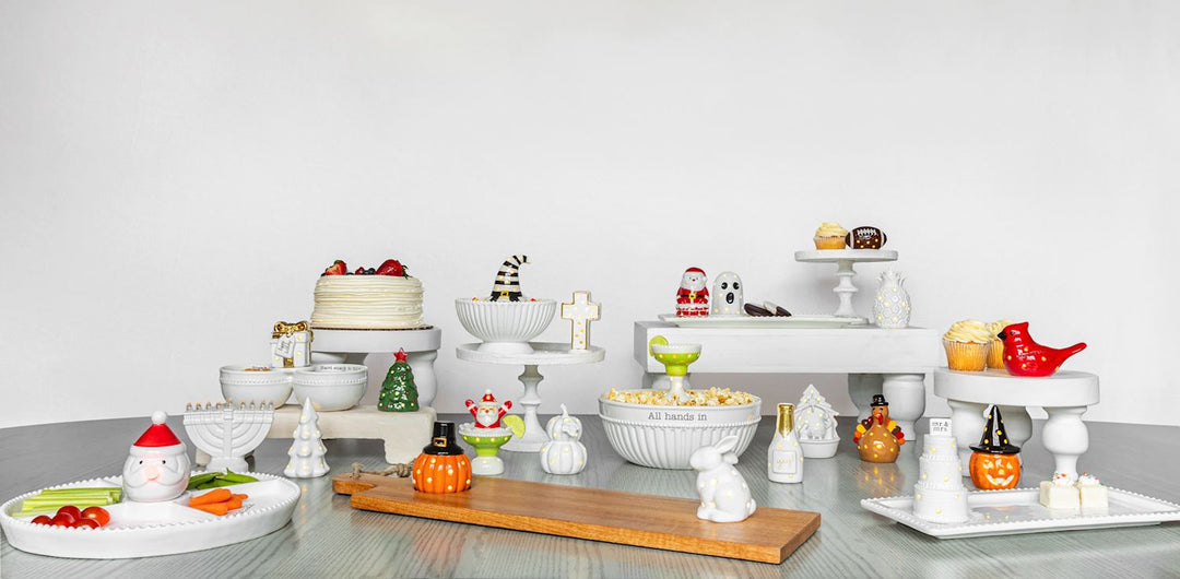 Holiday-themed ceramic serving dishes, Light-Up Nativity Sitter, and LED Christmas décor.