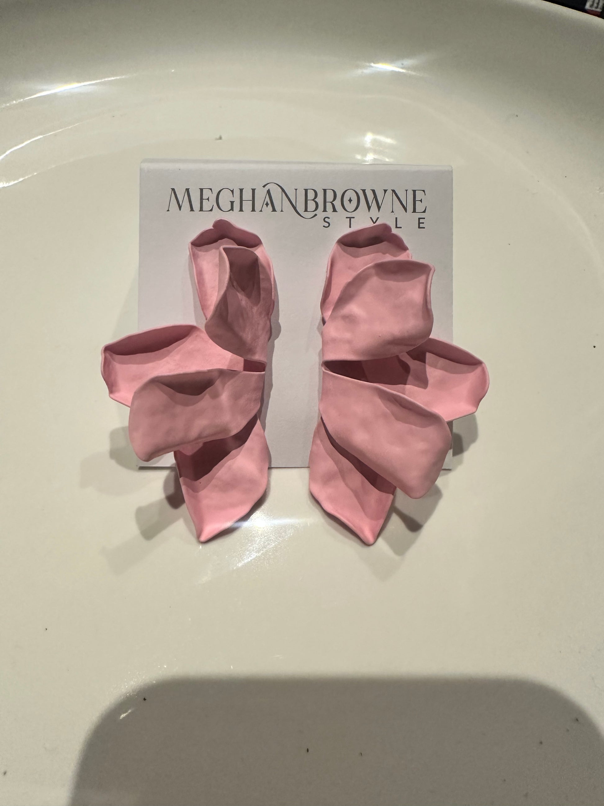 Large pink, flower-shaped statement Nellie Earrings; available in one size.