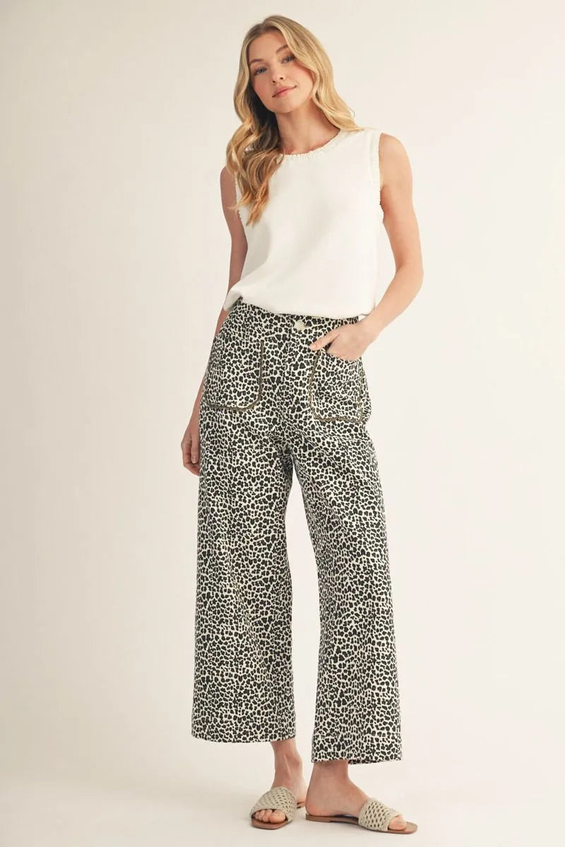 Ivory animal print jeans, high-waisted wide-leg silhouette with scalloped front pockets.