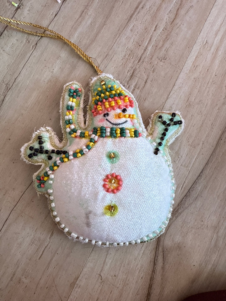 Cotton Velvet Snowman Ornament with embroidery, glass beads, and a gold hanging string.