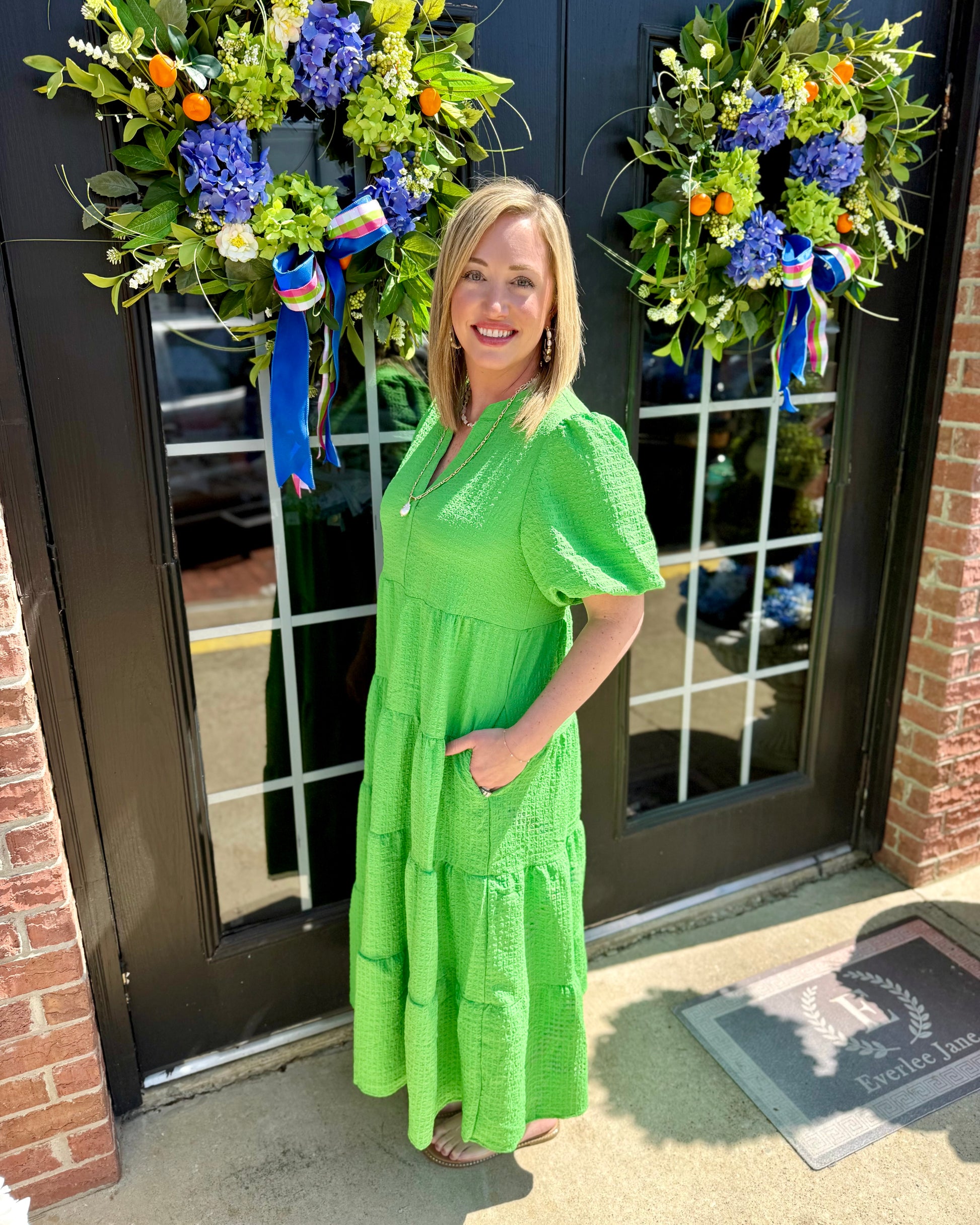Bright Kinsley Green Seersucker Dress, available in sizes XS-XL.