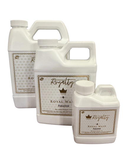 Bourbon Royalty Royal Wash: white bottles with gold crown logos, ornate borders; available in multiple sizes; Creole-scented.