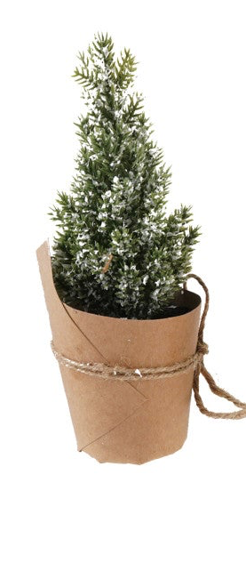 Snow-tipped faux tree wrapped in paper with a jute twine bow.