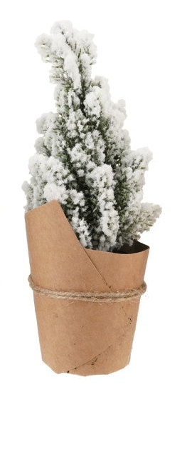 Snow-dusted faux pine tree in a paper-wrapped, jute-tied pot.