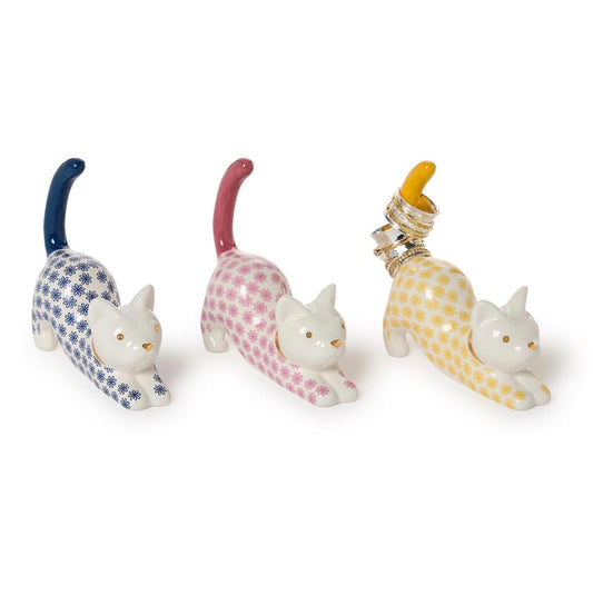 Ceramic cat-shaped ring holder in blue, pink, or yellow with patterned body and upright tail. Sizes available.