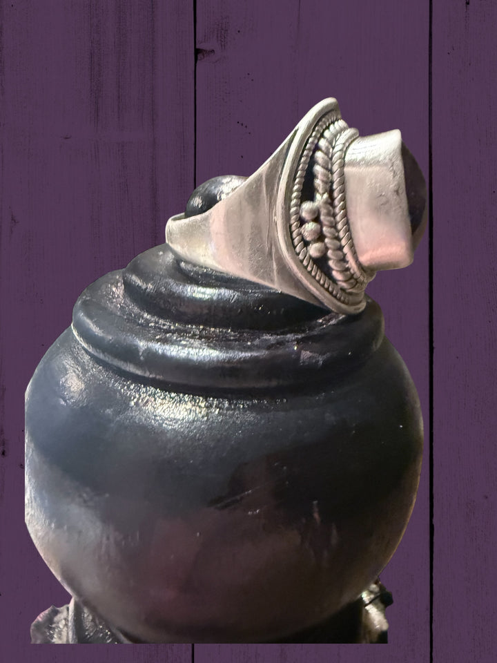 Vintage sterling silver ring with raised rectangular amethyst and citrine on ornate band. Available in sizes 6-9.