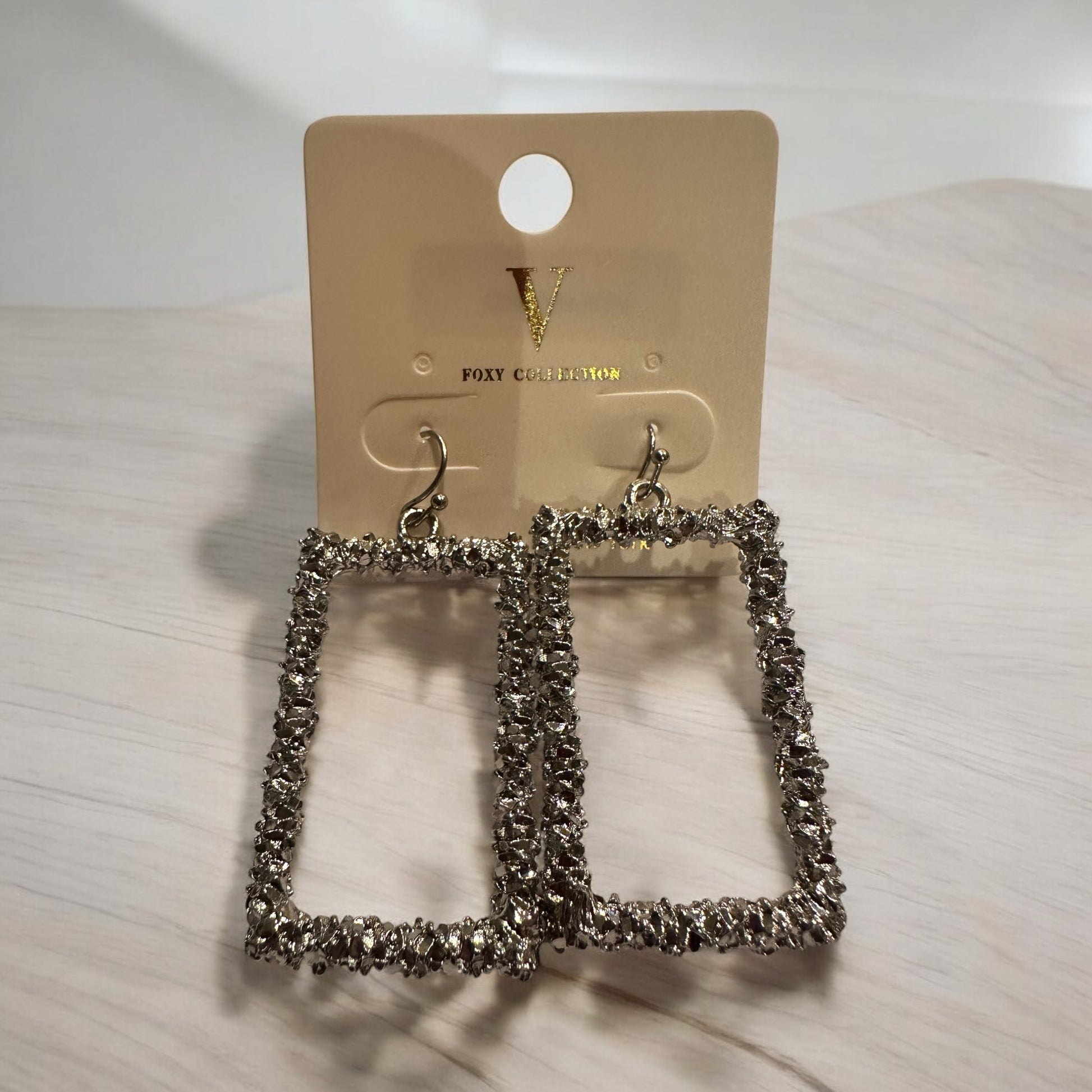 Silver Textured Open Rectangle Earrings with a sparkling finish. Available sizes: small, medium, large.