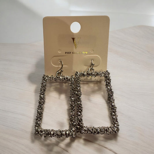 Silver Textured Open Rectangle Earrings with a sparkling finish. Available sizes: small, medium, large.