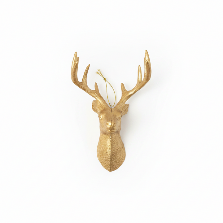 Gold-colored deer bust ornament with antlers and hanging string.