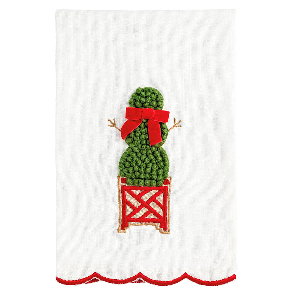 White Christmas topiary hand towel with scalloped red edge, featuring an embroidered green topiary in a red lattice planter with a red ribbon.