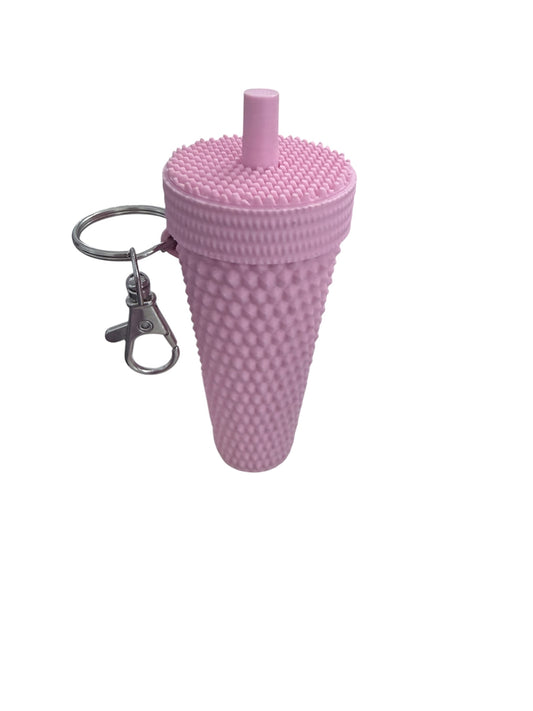 Textured pink silicone cup-shaped keychain with lid, straw, and attached metal keyring with clasp. Available in multiple sizes.