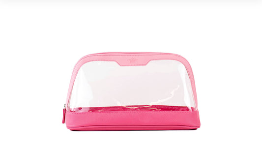 The Jenna Pink Cosmetic Case is a stylish, trapezoid-shaped pink bag with a transparent middle section and solid pink panels. It features a convenient pink zipper and is made from plastic and fabric materials. Available in small, medium, and large sizes.