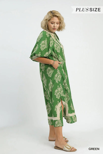 Green Abstract Print Midi Dress with knee-length, short sleeves, flowy silhouette, and breathable fabric. Available in plus sizes.