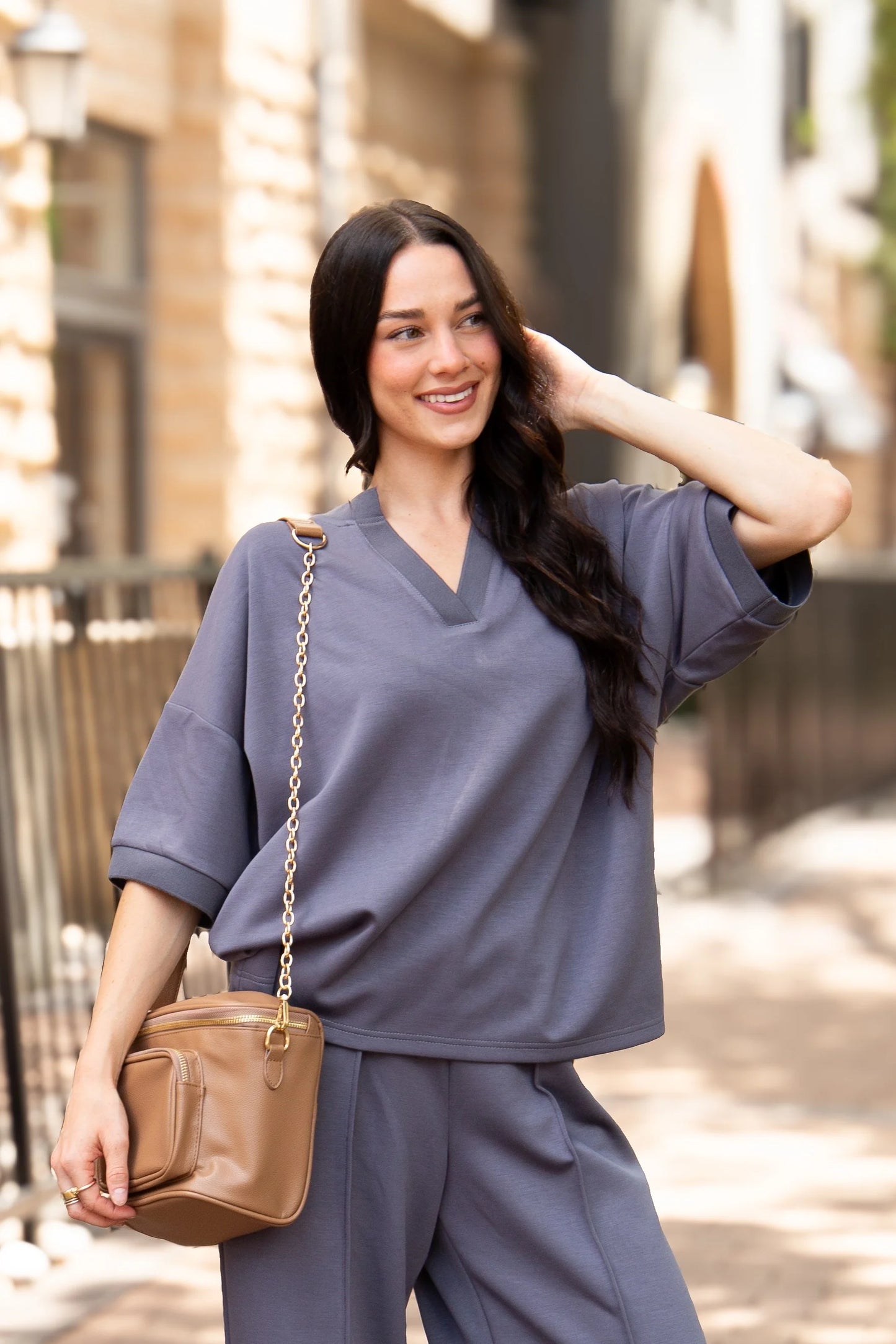 Slate Blue Butter Soft V-Neck Top made from buttery soft fabric, relaxed fit, available in sizes XS–XXL.