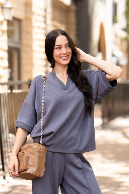 Slate Blue Butter Soft V-Neck Top made from buttery soft fabric, relaxed fit, available in sizes XS–XXL.