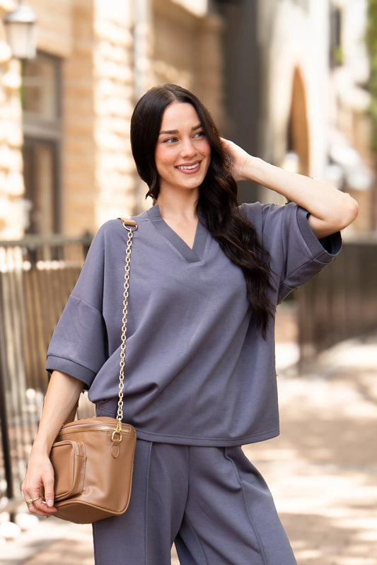 Slate Blue Butter Soft V-Neck Top made from buttery soft fabric, relaxed fit, available in sizes XS–XXL.
