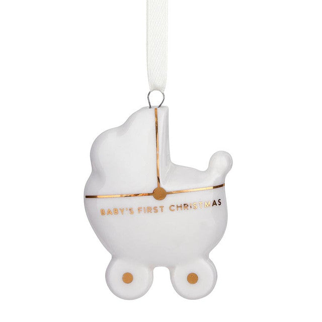 White ceramic “Baby’s First Christmas” baby carriage ornament with gold detailing on a white ribbon.