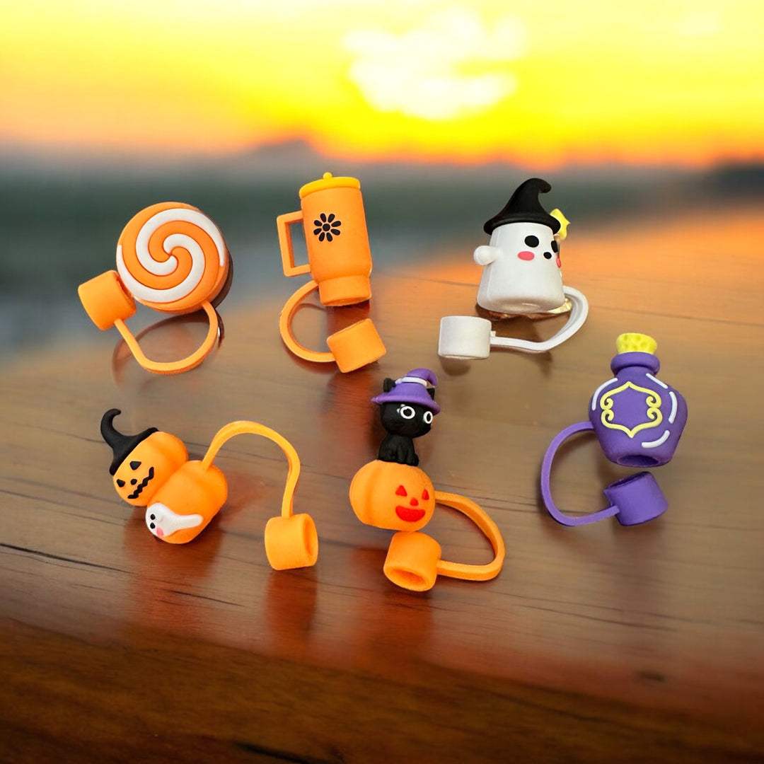 Six Halloween straw covers shaped like a lollipop, mug, ghost, pumpkin, black cat, and potion bottle.