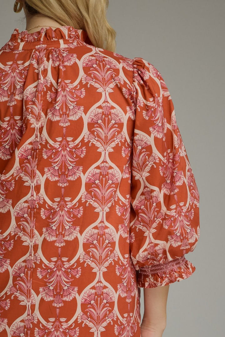 Nora Ruffle Midi Dress in rust floral print with ruffle collar and puff sleeves. Available in sizes XS-XL.