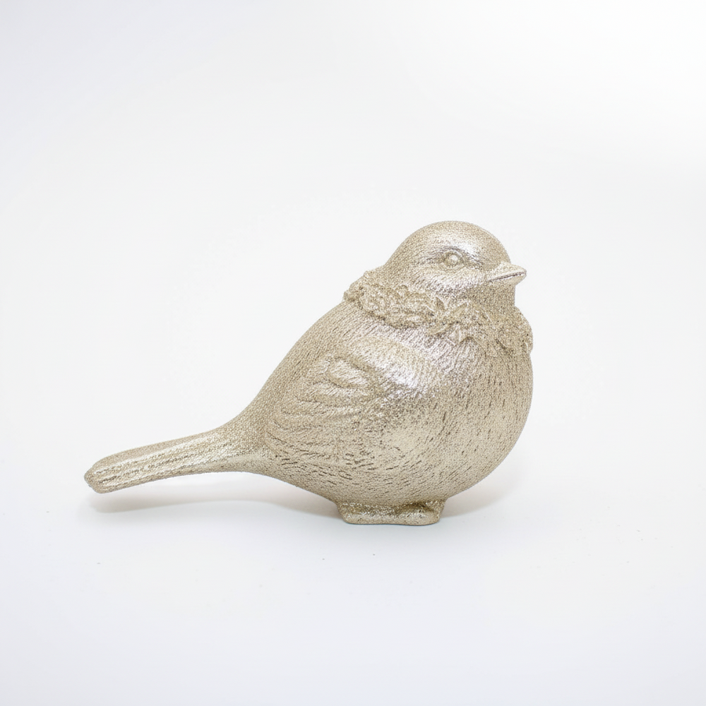 Textured metallic gold resin bird figurine.