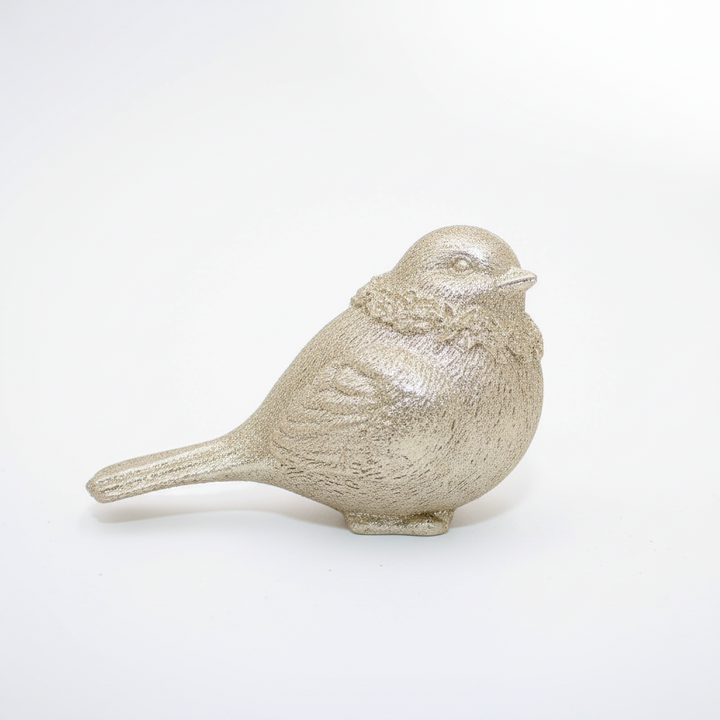 Textured metallic gold resin bird figurine.