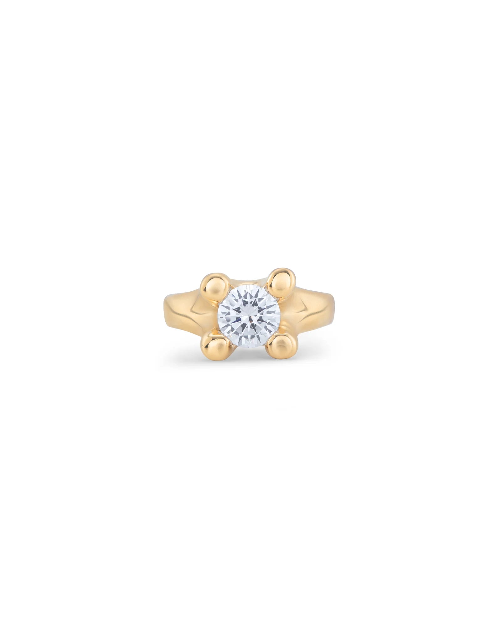 Gold ring with round, clear cubic zirconia in a four-prong setting. Available in multiple sizes.
